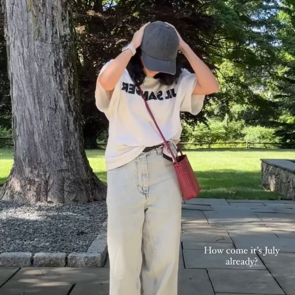 White Graphic T-Shirt with Red Crossbody Bag